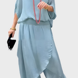 Plačios viršutinės dalies ir suplėšytos kelnės – dviejų dalių sijonas iš šifono